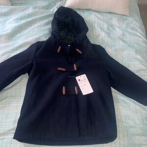 Never worn. Tags attached. Kids navy peacoat.